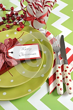 Christmas children family party table place settings in lime green, red and white