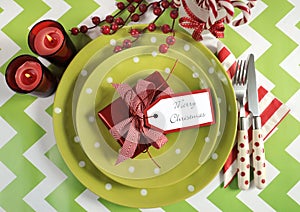 Christmas children family party table place settings in lime green, red and white