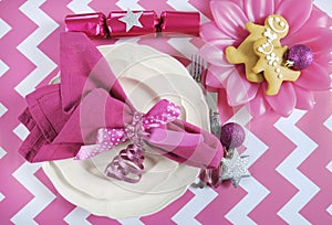 Christmas children family party table place settings in pink and white theme