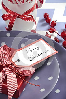 Christmas children family party table place settings in purple, red and white