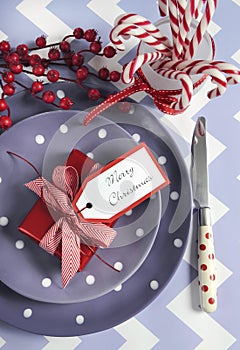 Christmas children family party table place settings in purple, red and white