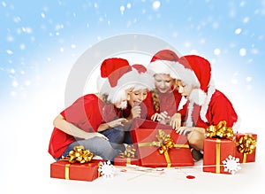 Christmas Children Open Presents, Kids Group in Santa Hat