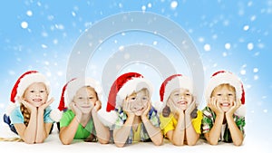 Christmas Children In Santa Helper Hat, Little Xmas Kids photo