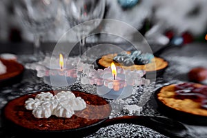 Christmas chocolate cookies with New Year& x27;s festive a candle decorations on the table