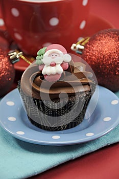 Christmas chocolate cupcake with Santa face - vertical close up