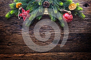 Christmas. Christmas decoration fir tree with star jingle bell and pine cone on rustic wooden table