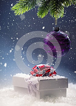 Christmas. Christmas gift box in abstract snowy scene. Christmas time