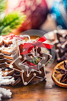 Christmas. Christmas homemade gingerbread cookies with various decorations. Red ribbon happy christmas