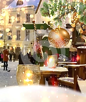 Christmas city market decoration on evening street lantern light and gold confetti,guirlande and blurred light in Tallinn old town