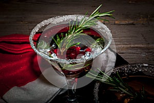 Christmas cocktail with cranberries and rosemary