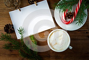 Christmas coffee latte or cappuccino with a notebook