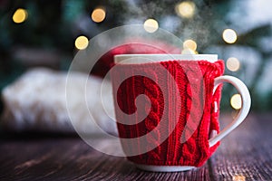 Christmas coffee or tea red mug with steam, homemade gingerbread christmas cookies on a wooden table, sweeters on