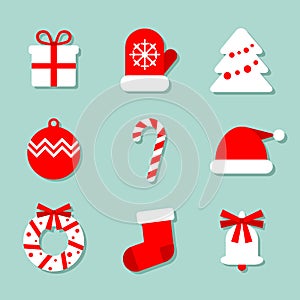 Christmas collection of 9 icons at blue background: mitten, Christmas tree, candy and Santa`s hat. Vector images