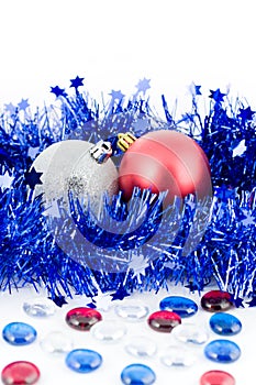 Christmas colored balls in blue tinsel