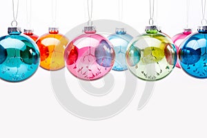 Christmas colorful balls transparent glass hanging on white background. Banner. Copy space