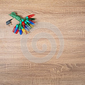 Christmas colorful lights on brown wooden background.