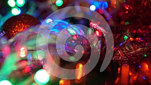 Christmas colorful New Year`s Bokeh neon lights. Abstract Blurred photo background with blinking lights from garlands and balls. D