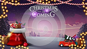 Christmas is coming, postcard with beautiful winter landscape, Santa Claus bag with presents and red vintage car