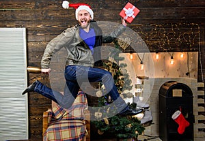 Christmas is coming. Spread happiness and joy. Bearded guy in motion jump. Delivery christmas present. Still have time