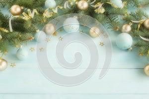 Christmas composition background from Christmas tree branches and gold blue decorations