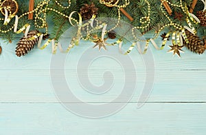 Christmas composition background from Christmas tree branches and gold blue decorations