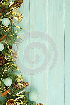 Christmas composition background from Christmas tree branches and gold blue decorations