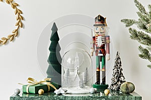 Christmas composition with beautiful decoration, christmas tree and wreath, deer, gifts and accessories in modern home decor.