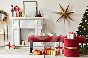 Christmas composition with beautiful decoration, christmas tree and wreath, deer, gifts and accessories in modern home decor.