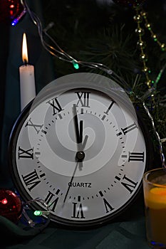 Christmas composition with candle and clock