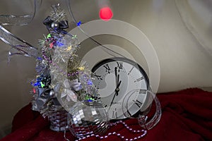 Christmas composition with candle and clock