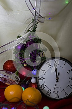 Christmas composition with candle and clock