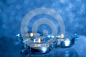 Christmas composition of candles on a blue background1