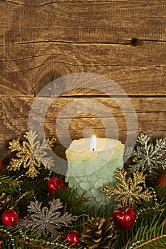 Christmas composition with candles on  wooden background
