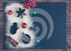 Christmas composition. Christmas background with copy space for text with flour on black background. Top view, flat lay