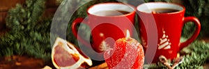 Christmas composition. Christmas cake pan de pasqua, red mug of tea and Christmas New Year decoration - fir brunches, fir and pine