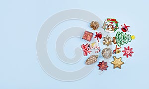 Christmas composition. Christmas gifts, decor, toys on a blue background in the form of a circle. Flat lay, top view. Banner with