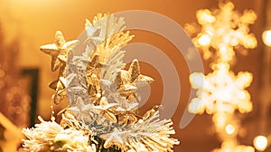 Christmas composition of Christmas tree toys on a gold background Christmas beautiful lights bokeh on gold warm