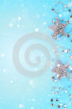 Christmas composition from Christmas tree toys. White decor on a blue background