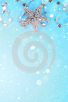 Christmas composition from Christmas tree toys. White decor on a blue background