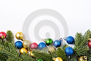 Christmas composition with copy space. Colorful ornament, baubles and fir needles decorations