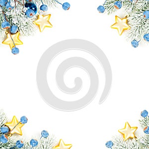 Christmas composition corner top view. Colorful winter background with green Xmas tree twig, blue decoration and gold stars