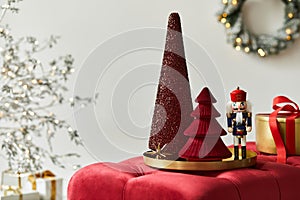Christmas composition with decoration, christmas tree, gifts and accessories in cozy home decor. Copy space.