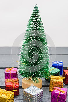 Christmas composition decorations, minimal green fir tree branches with snow and gift boxs on white background