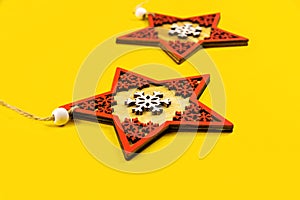 Christmas composition, decorative wooden stars, yellow background, layout, template, top view