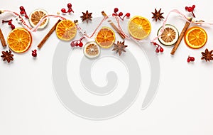 Christmas composition with dried oranges and spices on white background. Natural food ingredient for cooking or Christmas decor