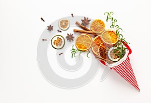 Christmas composition with dried oranges and spices on white background. Natural food ingredient for cooking or Christmas decor