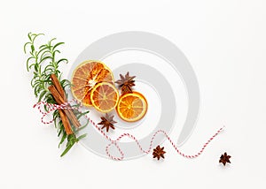 Christmas composition with dried oranges and spices on white background. Natural food ingredient for cooking or Christmas decor