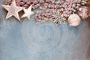 Christmas composition fir tree branches, gold sterne on blue background