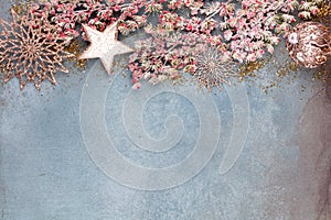 Christmas composition fir tree branches, gold sterne on blue background