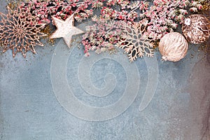 Christmas composition fir tree branches, gold sterne on blue background